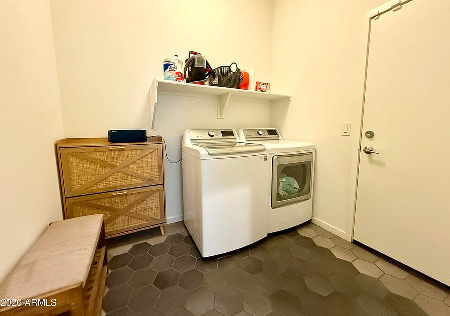 Convenient in-unit laundry area with full-size washer and dryer.