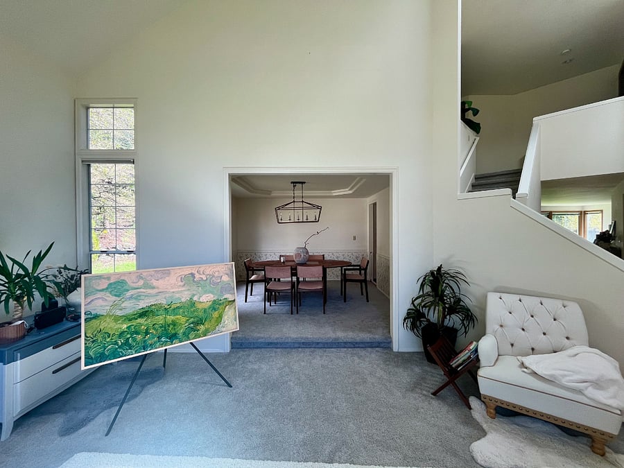 Directly connected to the formal dining room is the formal dining room. It features a mid modern design and gorgeous solid wood dining table and chairs.
