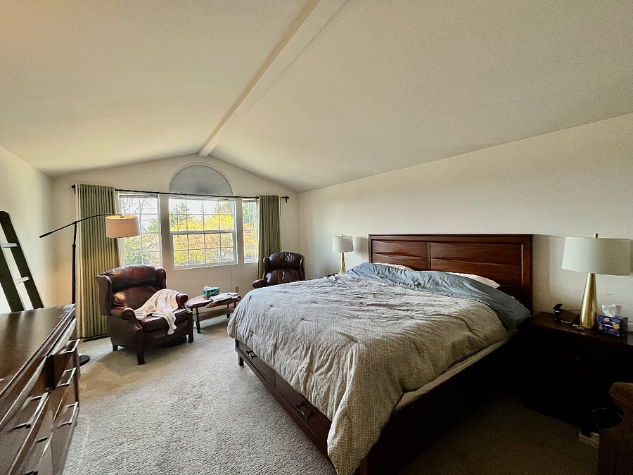 Another angle of the primary bedroom. Two very comfortable recliner chairs for day or night time reading.