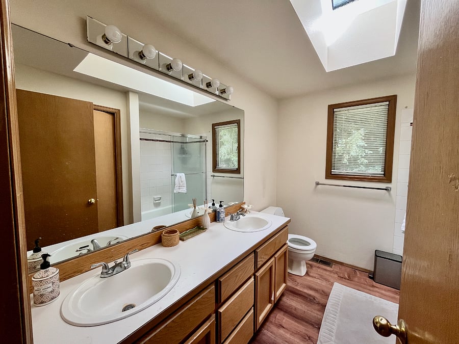 Guest bathroom, shared by the secondary bedroom in the office, also double sinks.
