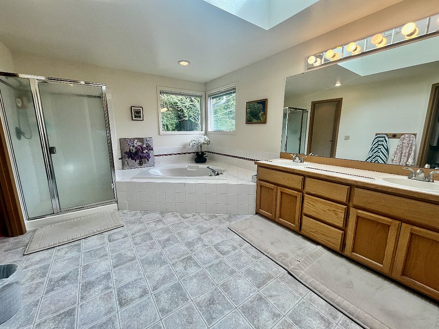 Primary bathroom with a five-piece full bathroom set.