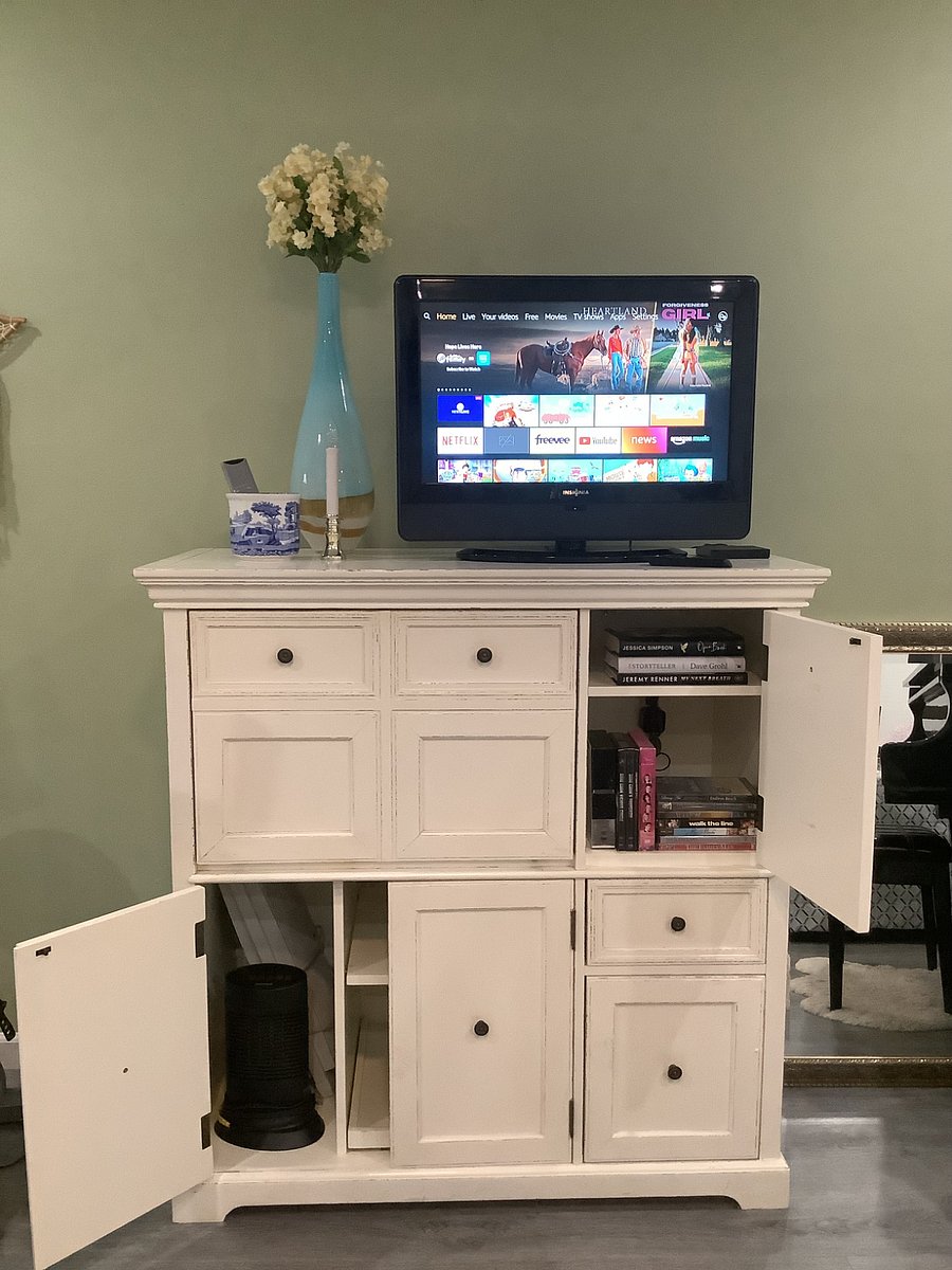 Storage cabinet, books, videos.