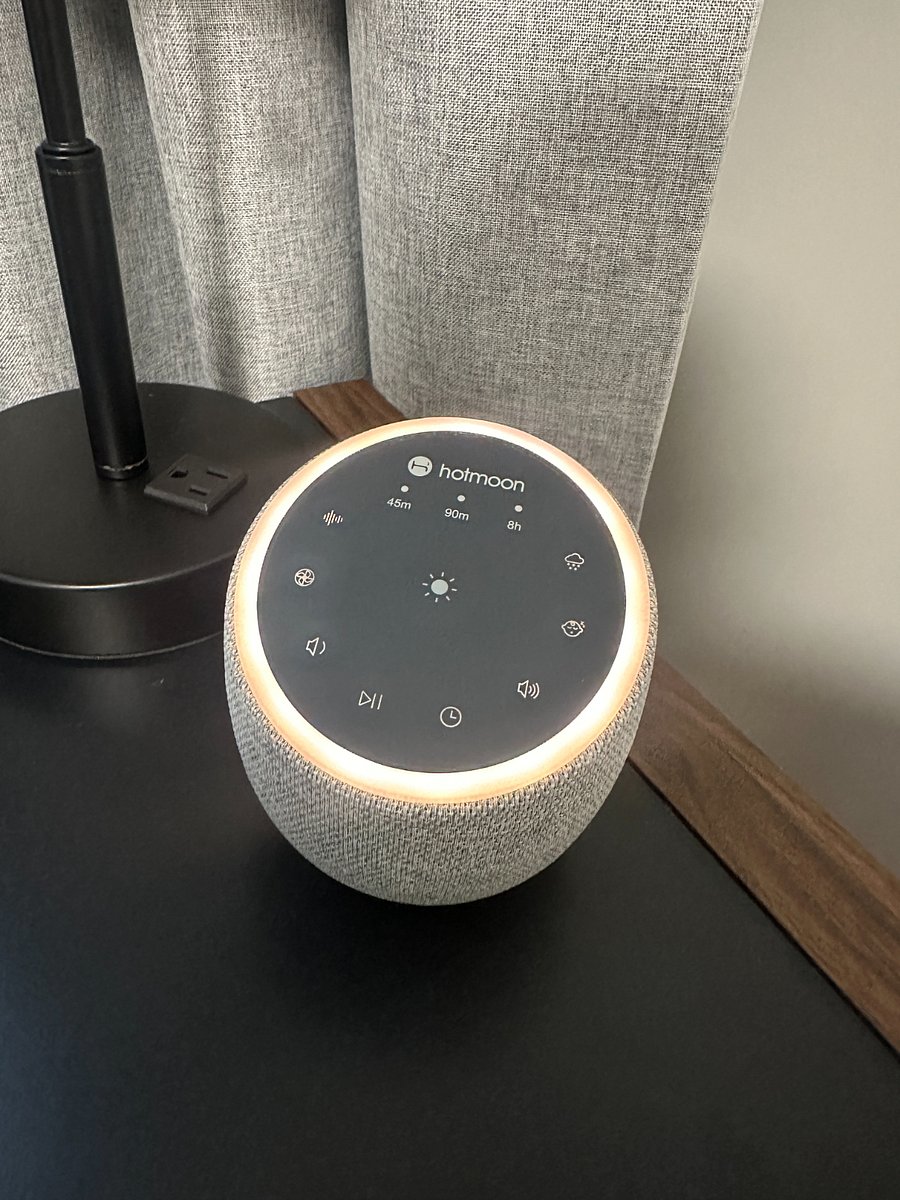 Noise machine w/ white noise, fan sounds, rain, lullaby tunes, volume, timer, and a glow ring.