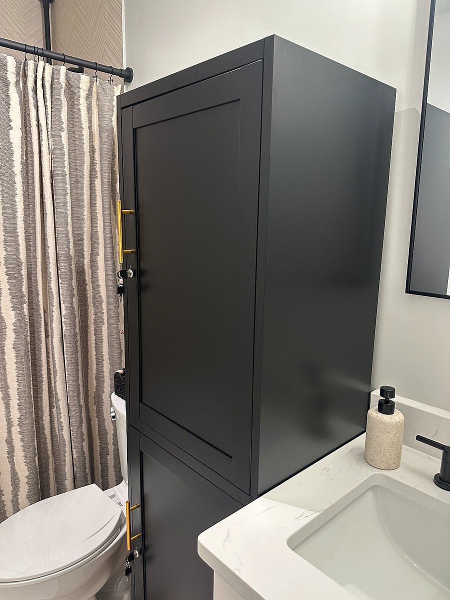 Large locker with two locked halves (top and bottom), one for each of the rooms who share this bathroom.