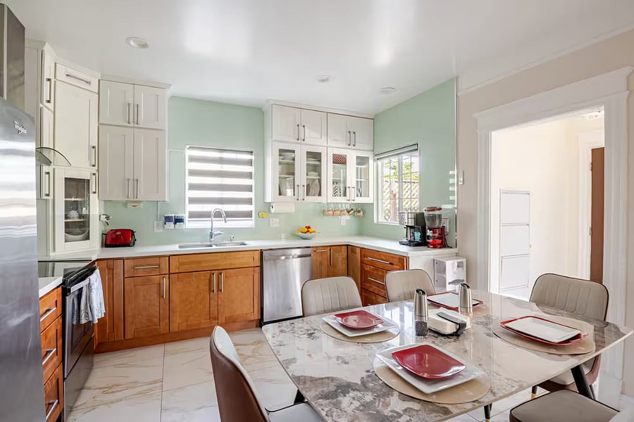 Kitchen: Thoughtfully stocked and ready for shared meals, this kitchen includes modern appliances, easy-to-use cookware, and all the dining basics. Its a practical space perfect for quick family breakfasts or dinner after a day of fun.