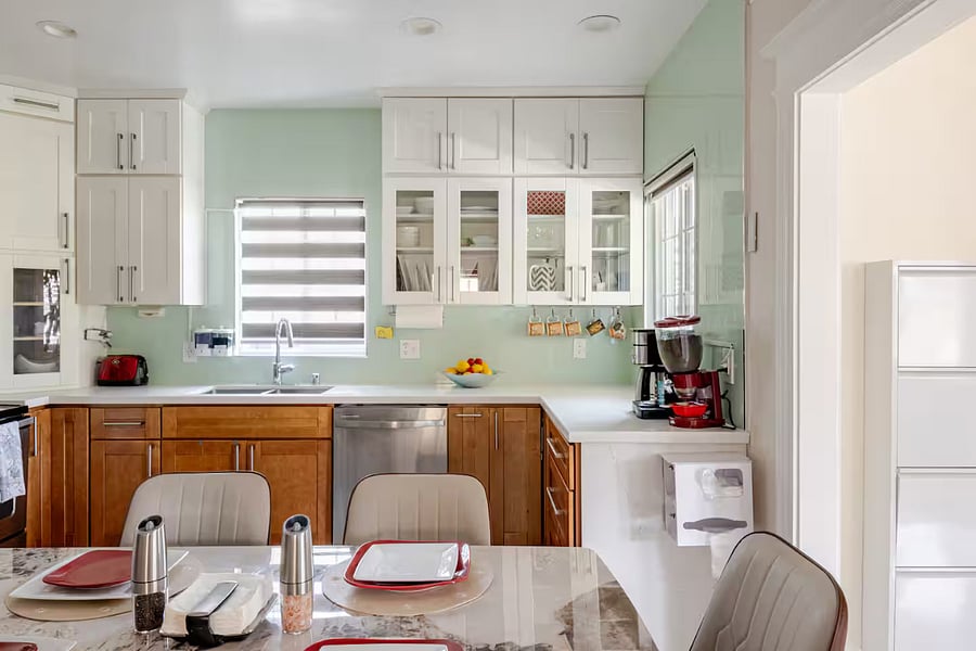 Kitchen: A sleek coffee and tea bar corner in the kitchen is thoughtfully stocked with essentials, making it easy to prepare your favorite hot beverages anytime.