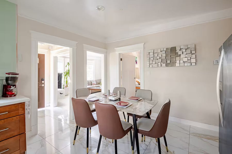 Dining Area: Conveniently located in the kitchen, this stylish dining space features a sleek stone-top table with sturdy metal legs& easy-to-clean chairsperfect for enjoying morning coffee, meals, or connecting over dinner after a day of exploring.