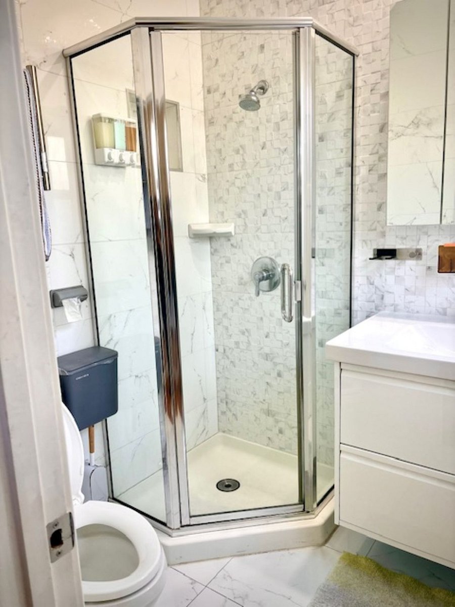 Bathroom #1 : Fully tiled from floor to ceiling, creating a dust-free, mold-resistant environment that complements the stylish bathroom design