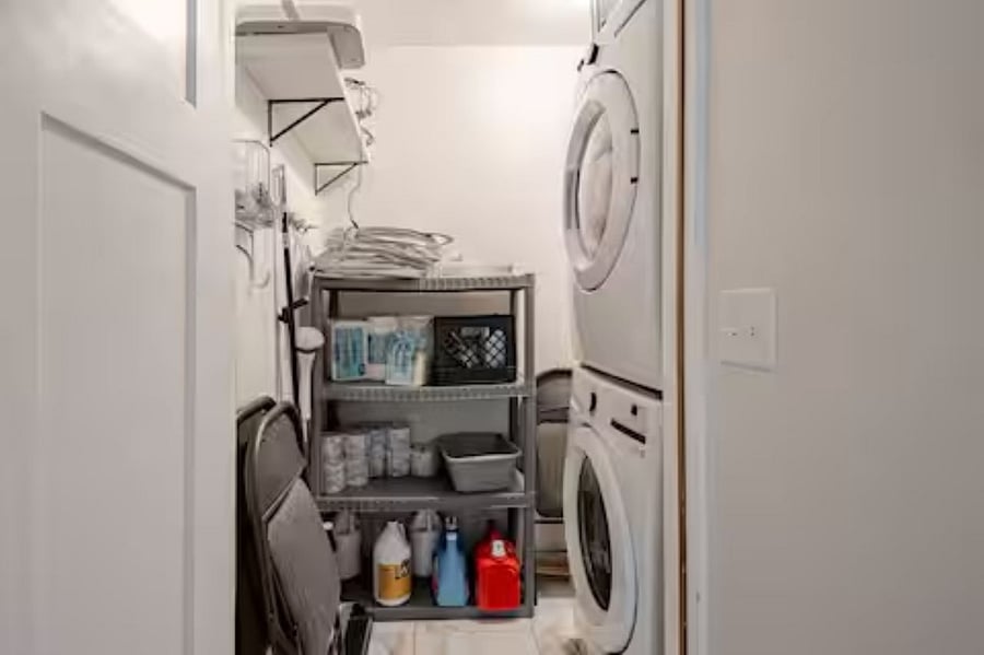 Laundry Room: Equipped with a stackable washer and dryer for your convenience, this space also offers extra chairs &storage for essentials. Laundry soap, bath products, paper towels, napkins are thoughtfully provided &neatly organized for easy access.