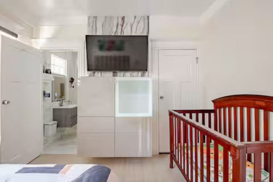 Bedroom #3(Queen bed): The smart zebra shade allows natural light to fill the room, while the beautiful accent TV wall  featuring a smart TV & a modern wall-mounted dresser adds both function &elegance, enhancing the rooms style &entertainment experience.