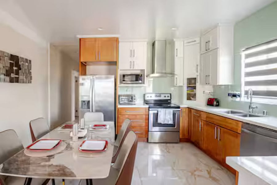 Kitchen: This warm and welcoming kitchen offers everything you need to feel right at homefrom modern appliances to thoughtfully stocked cookware & tableware. Whether you're preparing comfort food or a quick snack, its all here for your convenience.