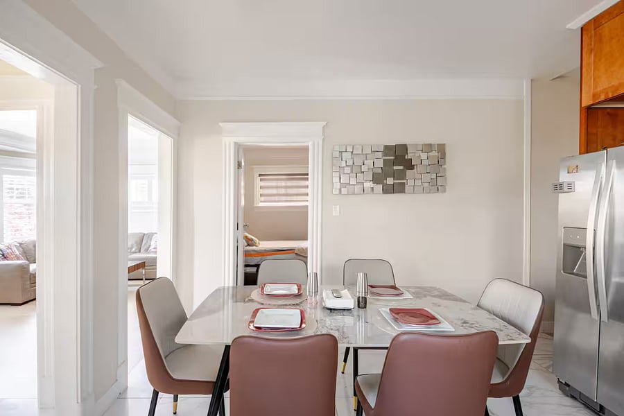Dining Area: Nestled in the heart of the kitchen, this warm and inviting dining nook features a stone-top table and comfortable, low-maintenance chairsideal for sipping morning coffee, sharing meals, or unwinding together after a day of adventure.