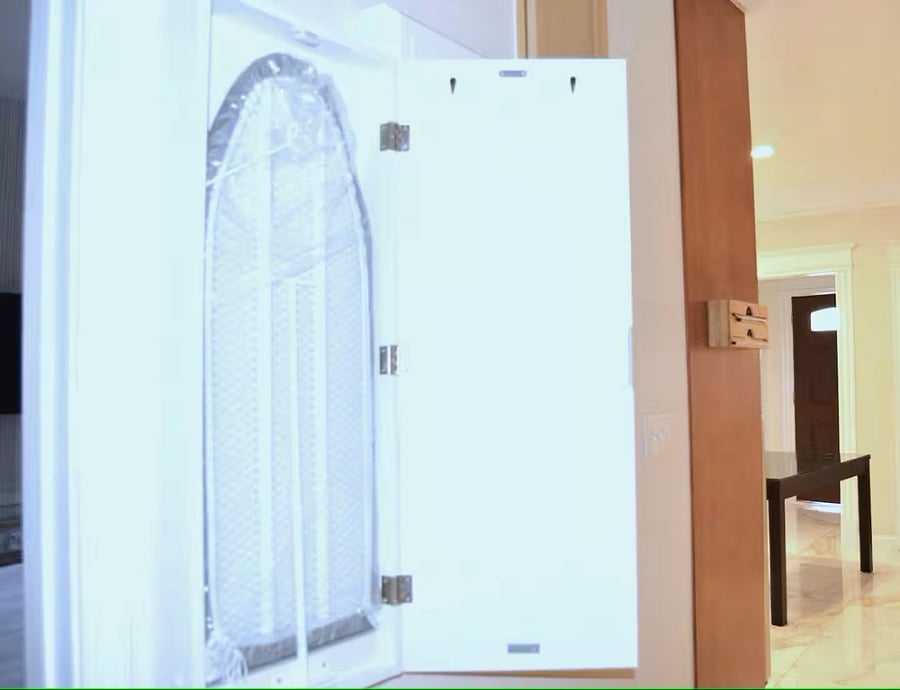 Hallway: The built-in ironing board, offering a convenient, space-saving solution for laundry care