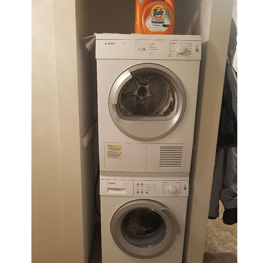 Stacked washer and dryer. Comes with detergent and dryer sheets.