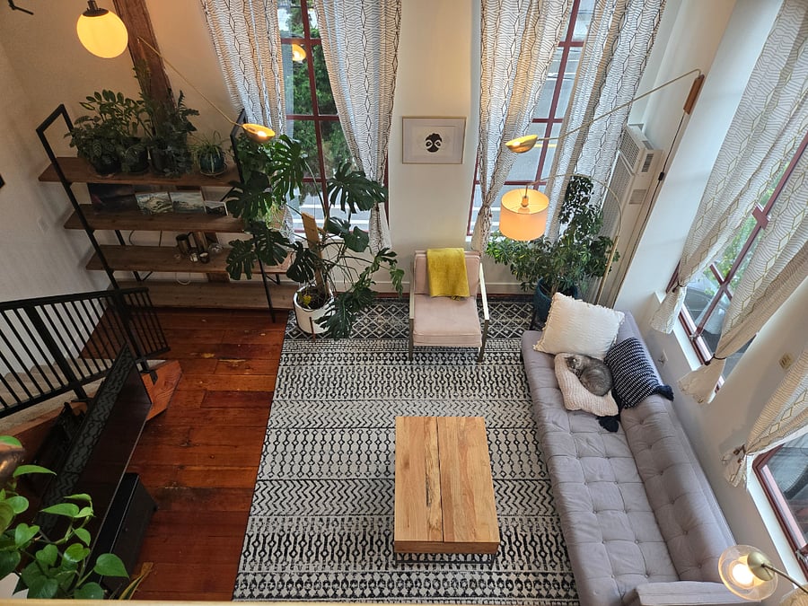 3rd Floor - View to Living Room below. Huge corner windows