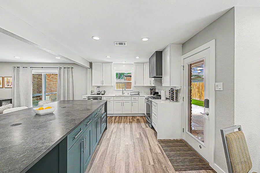 Kitchen area with door to access patio and garage