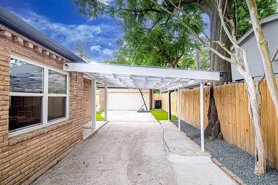 Driveway with a small cover to parking