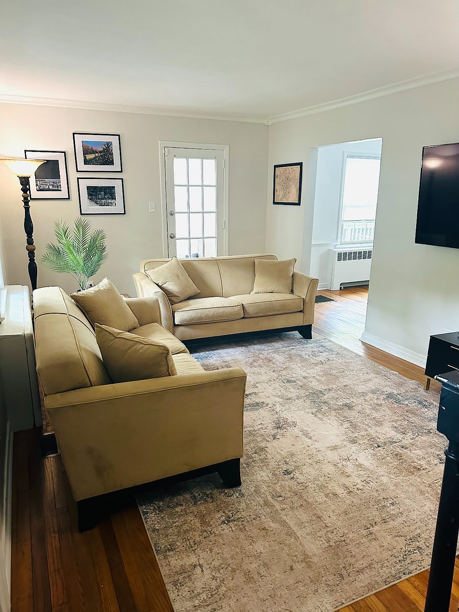 Living room w/ 2 couches, and 60 inch smart tv; perfect for relaxation.