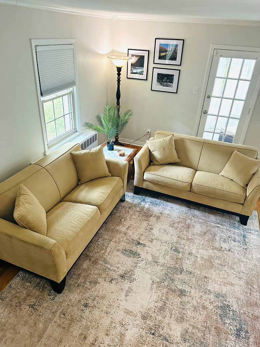 Living room w/ 2 couches, and 60 inch smart tv; perfect for relaxation.