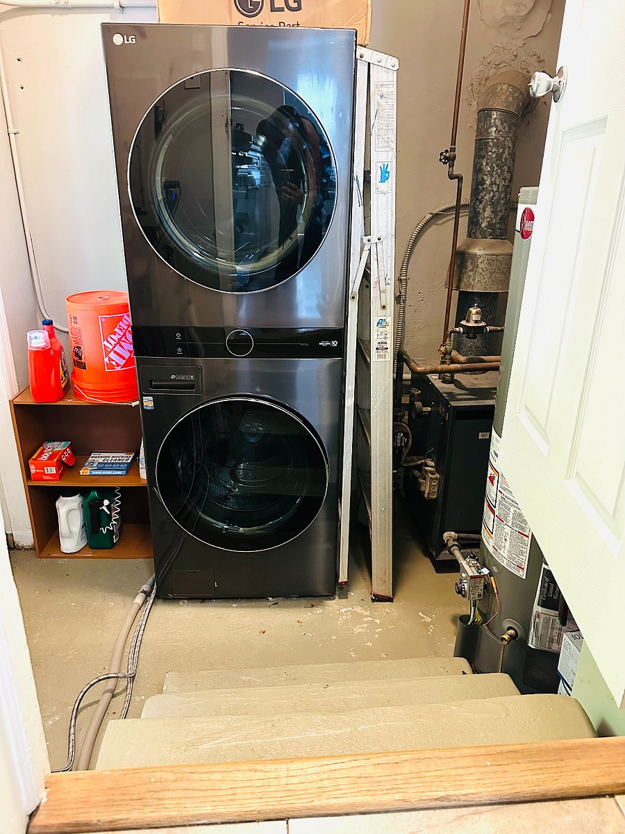 Laundry Room w/ LG smart washer and dryer, leads to backyard.