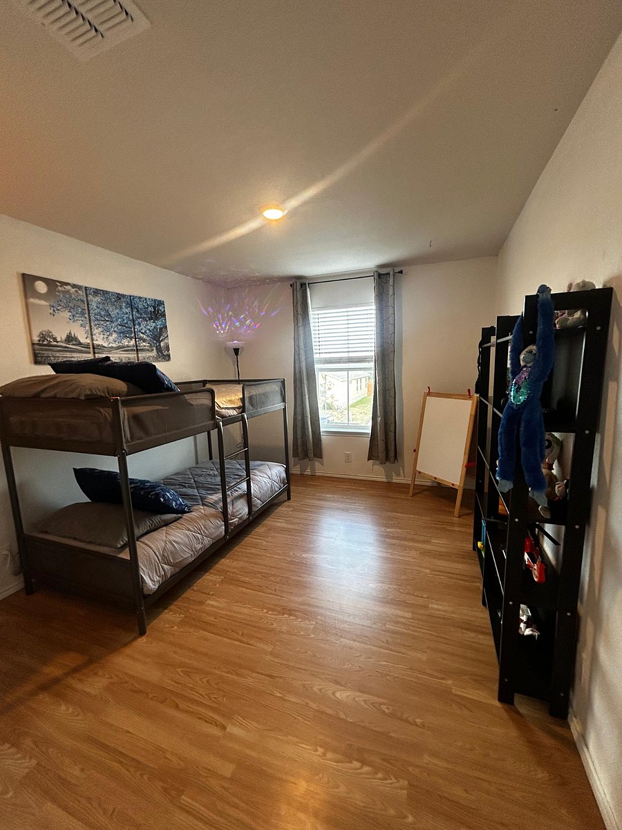 Fourth bedroom, bunk bed with blackout curtains. Toys available for children to play.