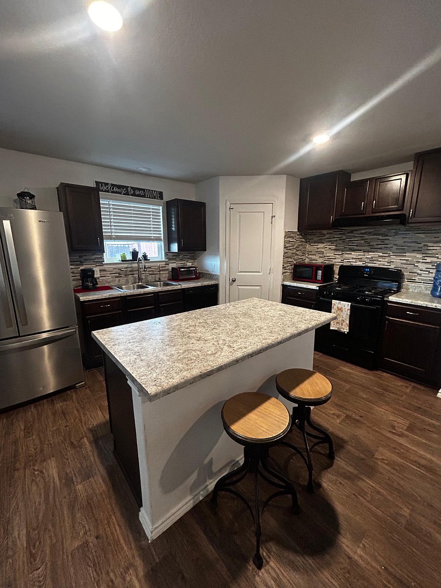 Full kitchen with all appliances, including coffee maker, toaster oven, microwave, and more. 