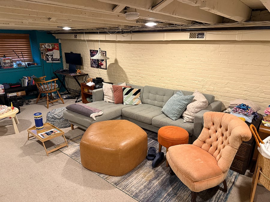basement with office, living space and queen bed