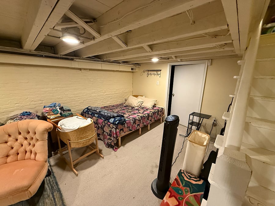 basement with office, living space and queen bed