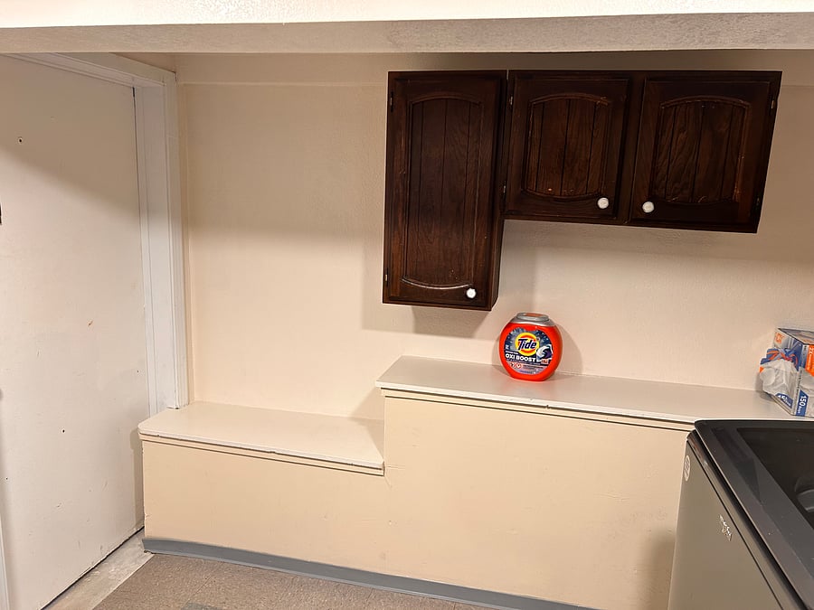 Private cabinet storage for kitchen and laundry items.