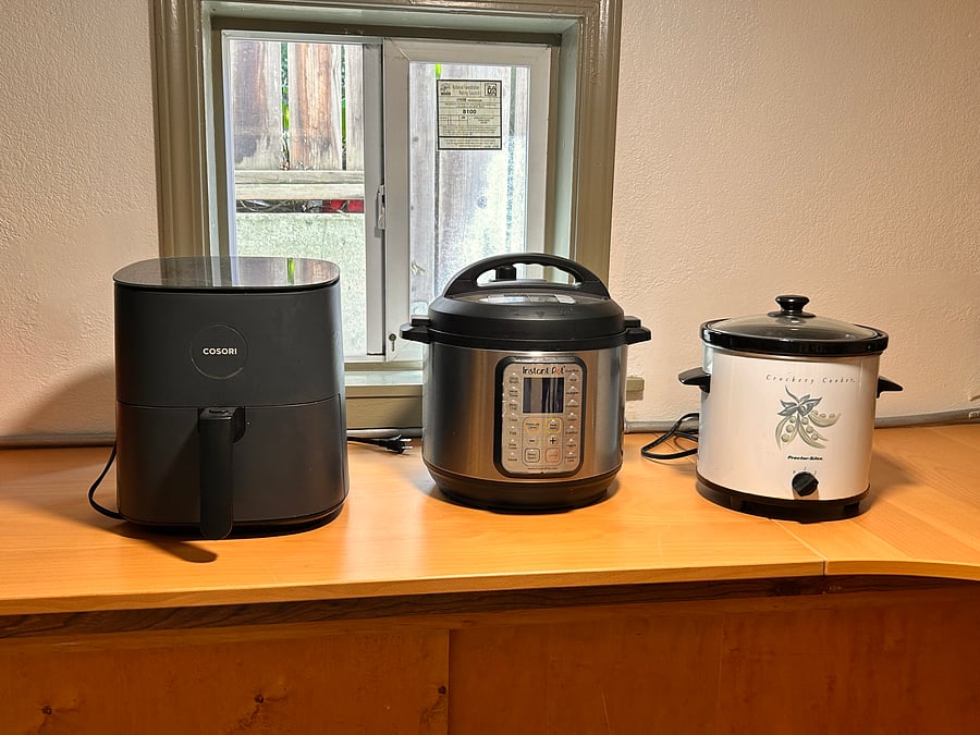 Fryer, instant pot, and crockpot for cooking. These items are shared with the owner occupant.