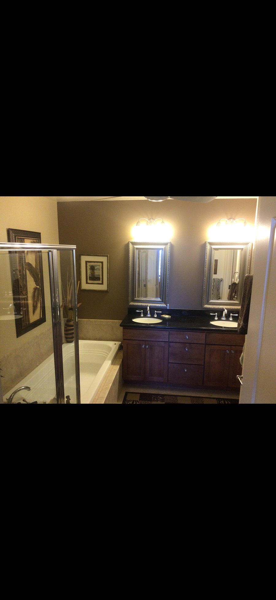 Master bath has dual sinks, large soaking tub and enclosed Rain shower 
