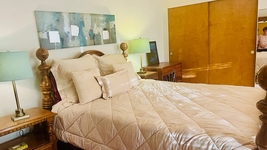 Oversized Bedroom C on Floor 2 with Double Closets and Queen Size Bed, dresser and desk and bureau and two night stands and three lamps, with shared full all bath shared with one on left. Very Spacious and Bright and Airy 