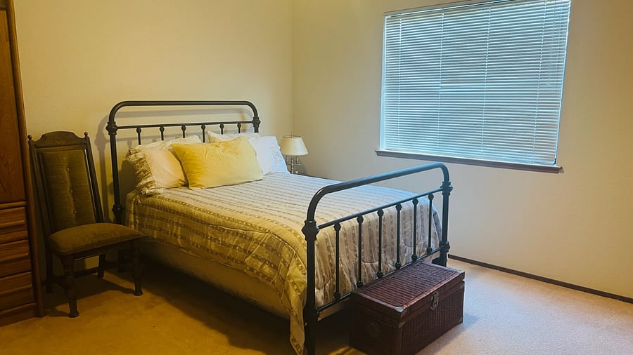 Bedroom A Floor 1 with shared  full bath on right, described in ad, with full bed, nightstand with lamp, dresser, chair and cabinet, large closet.