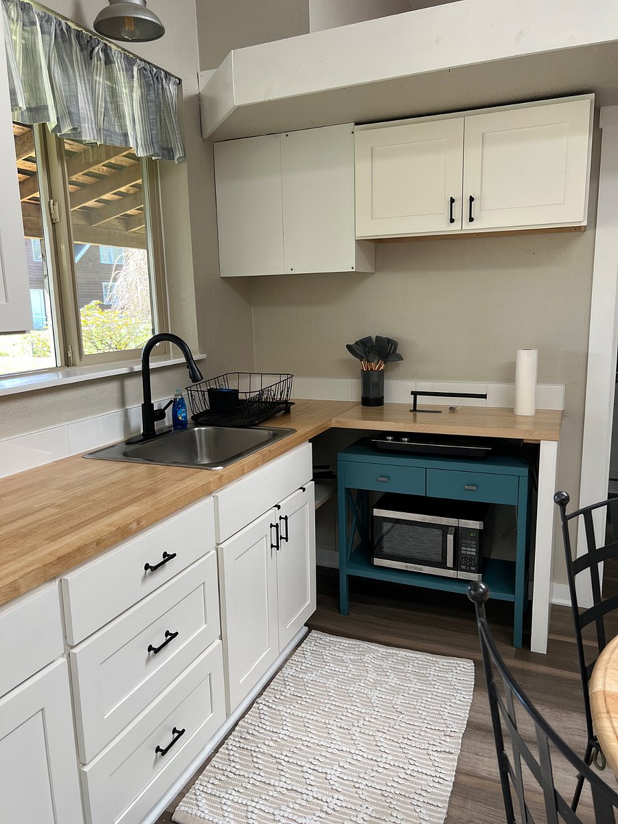 Electric cooktop. Microwave. Toaster oven. Hot water kettle. Coffee pot. No dishwasher. 