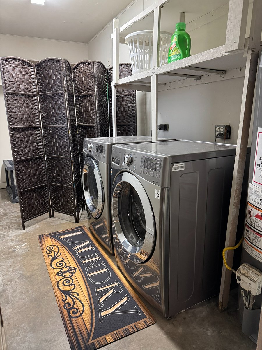 Private laundry area located just off the screened-in patio for added convenience.