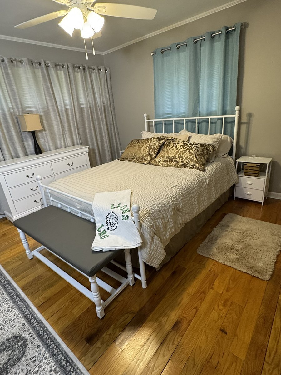 Second bedroom has queen-size bed with blackout curtains