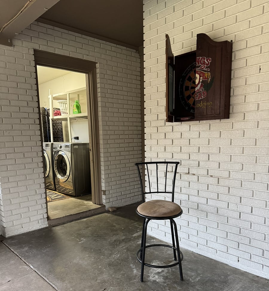 Private laundry area located just off the screened-in patio for added convenience.