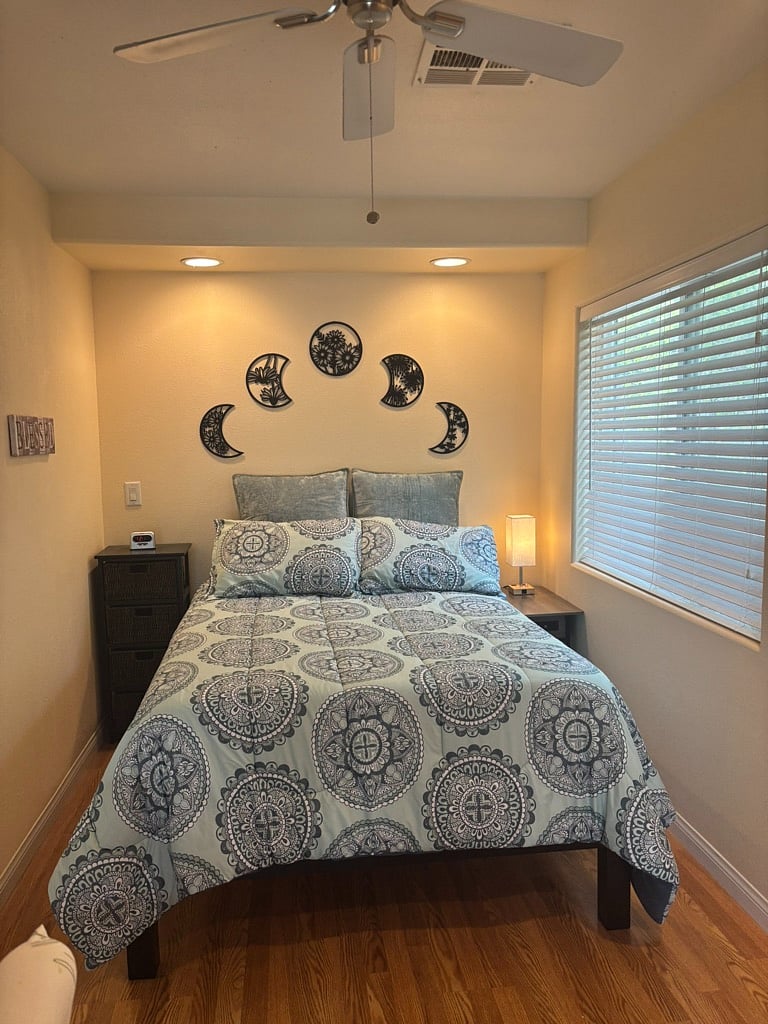 dedicated bedroom space w/ window & nightstands