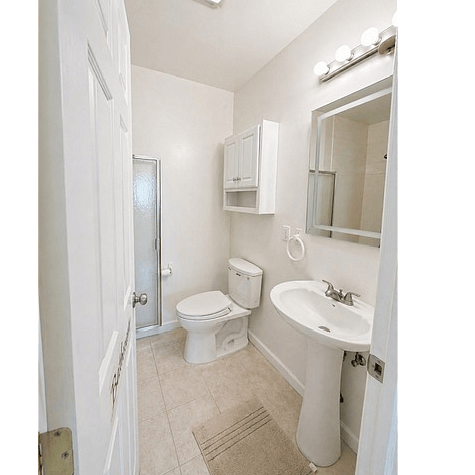 Private attached bathroom. Modern fixtures and plenty of storage for your essentials.