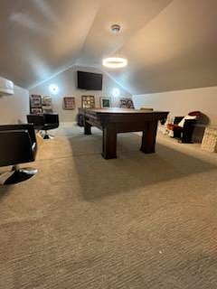 Game room with pool table, TV and large vinyl record collection.