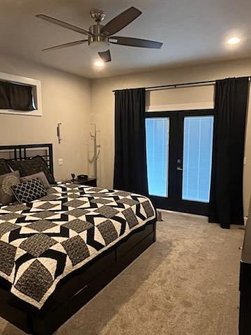 Master Bedroom with King Bed and room darkening curtains.  French doors lead out to hot tub.