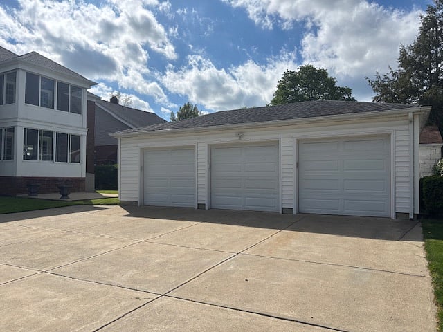 3 Car Garage, Bay on far right goes with upper unit. To the left you see the screened in porches