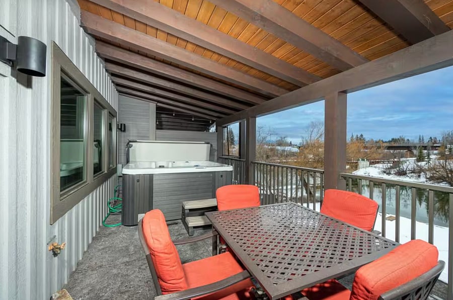 3rd floor balcony with seating and hot tub
