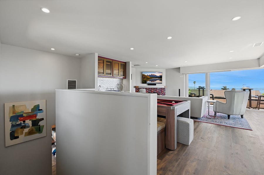 Upstairs family room with wet bar, pool table, ping-pong table and Smart TV
