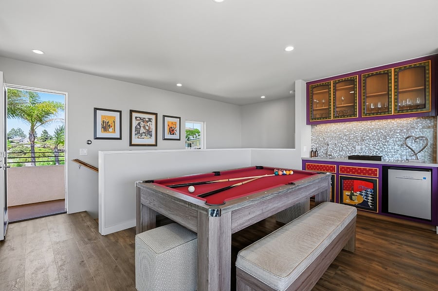 Upstairs family room with wet bar, pool table, ping-pong table and Smart TV