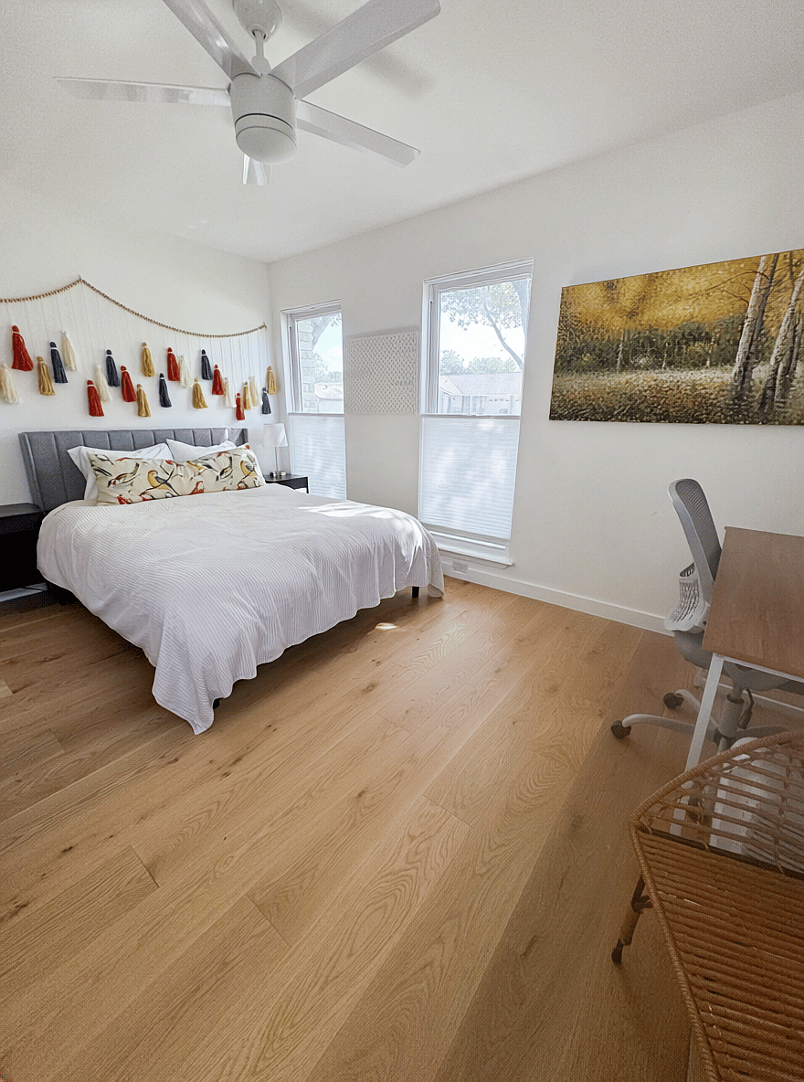 Third bedroom features desk, full closet, and TV with Roku