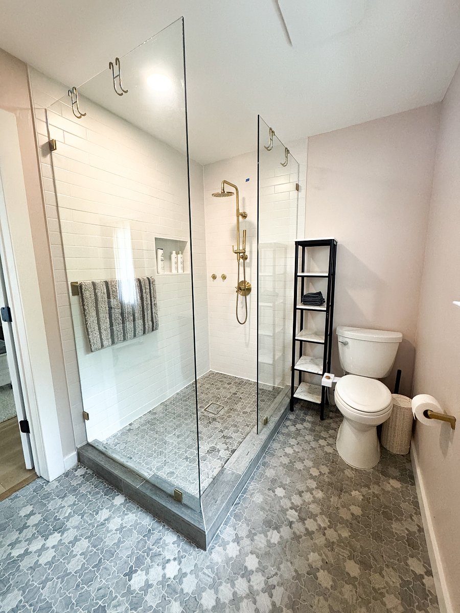 Primary bathroom features rain shower and bidet