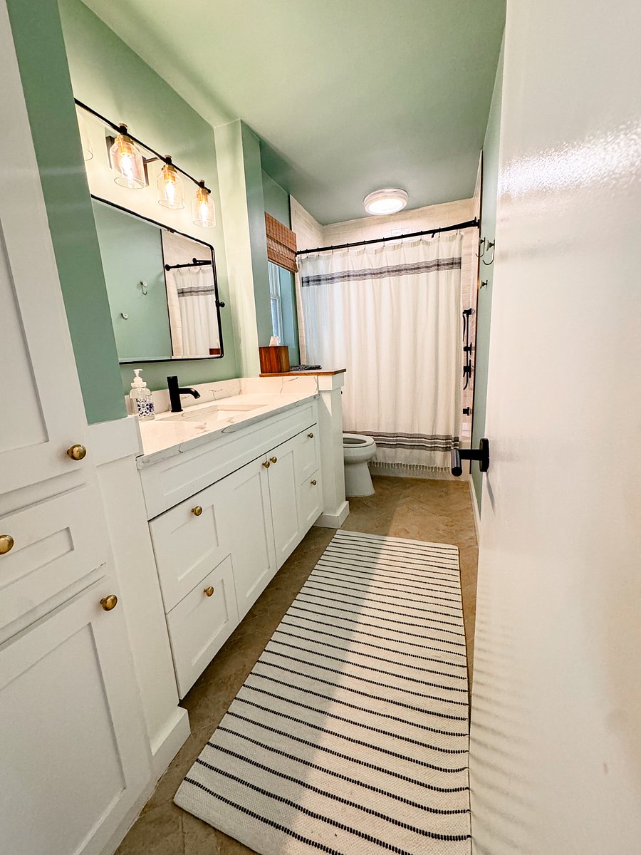 Hall bath features high end fixtures, full sized tub and bidet