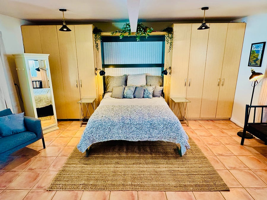 Murphy Bed in detached studio opens to a queen bed, and offers plenty of space when tucked away.