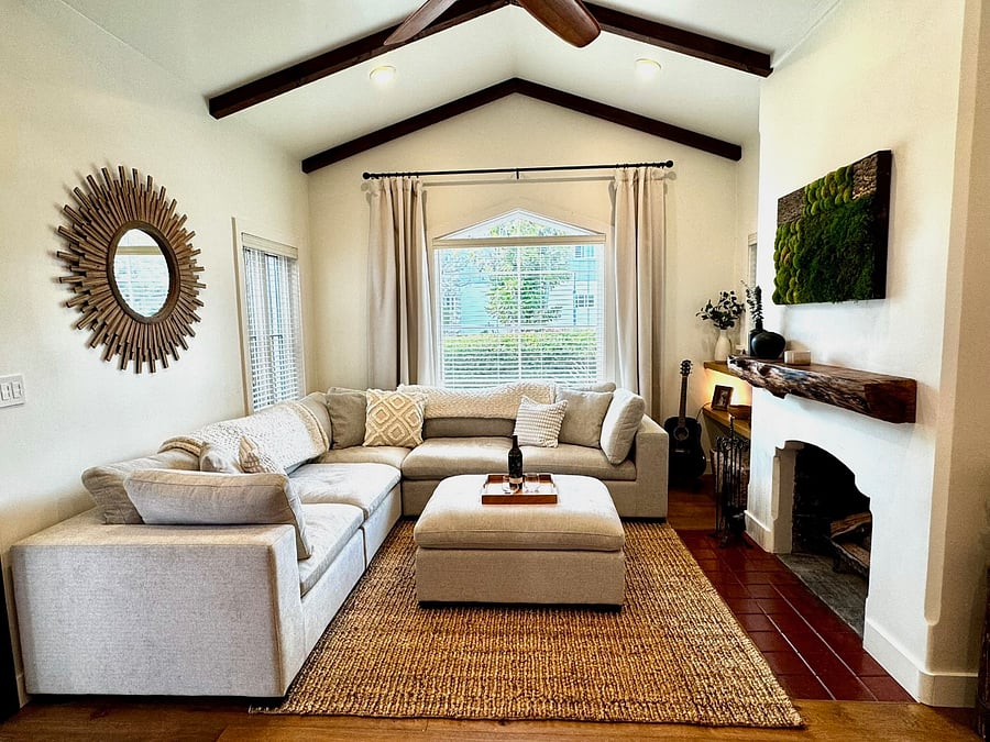 Living Room with cozy couch and fireplace and large smart TV